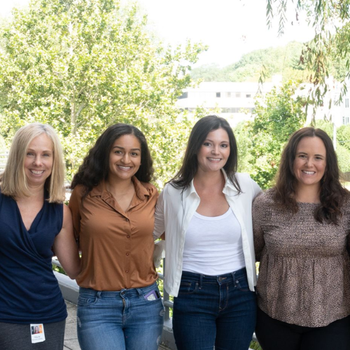 A group of four RXers posing together from different cultures